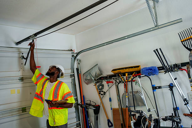 Professional Garage Door Panel Replacement technician working in Rockaway Beach, OR